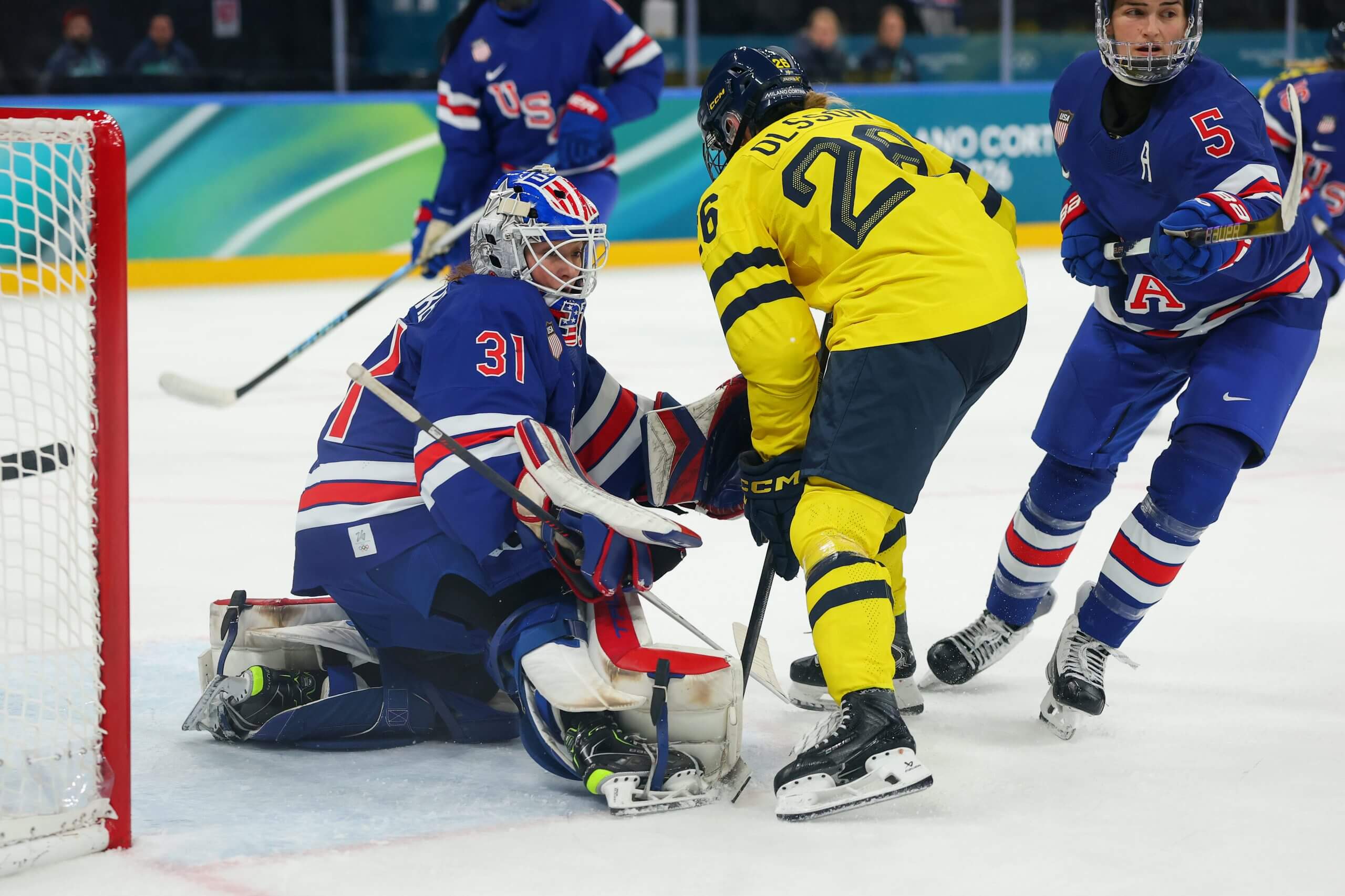 Aerin Frankel #31 of Team United States defends the net against Hanna Olsson #26 of Team Sweden in the third period during the Women's Playoffs Semifinal match between United States and Sweden on Day 10 of the Milano Cortina 2026 Winter Olympic games at Milano Santagiulia Ice Hockey Arena on February 16, 2026 in Milan, Italy.