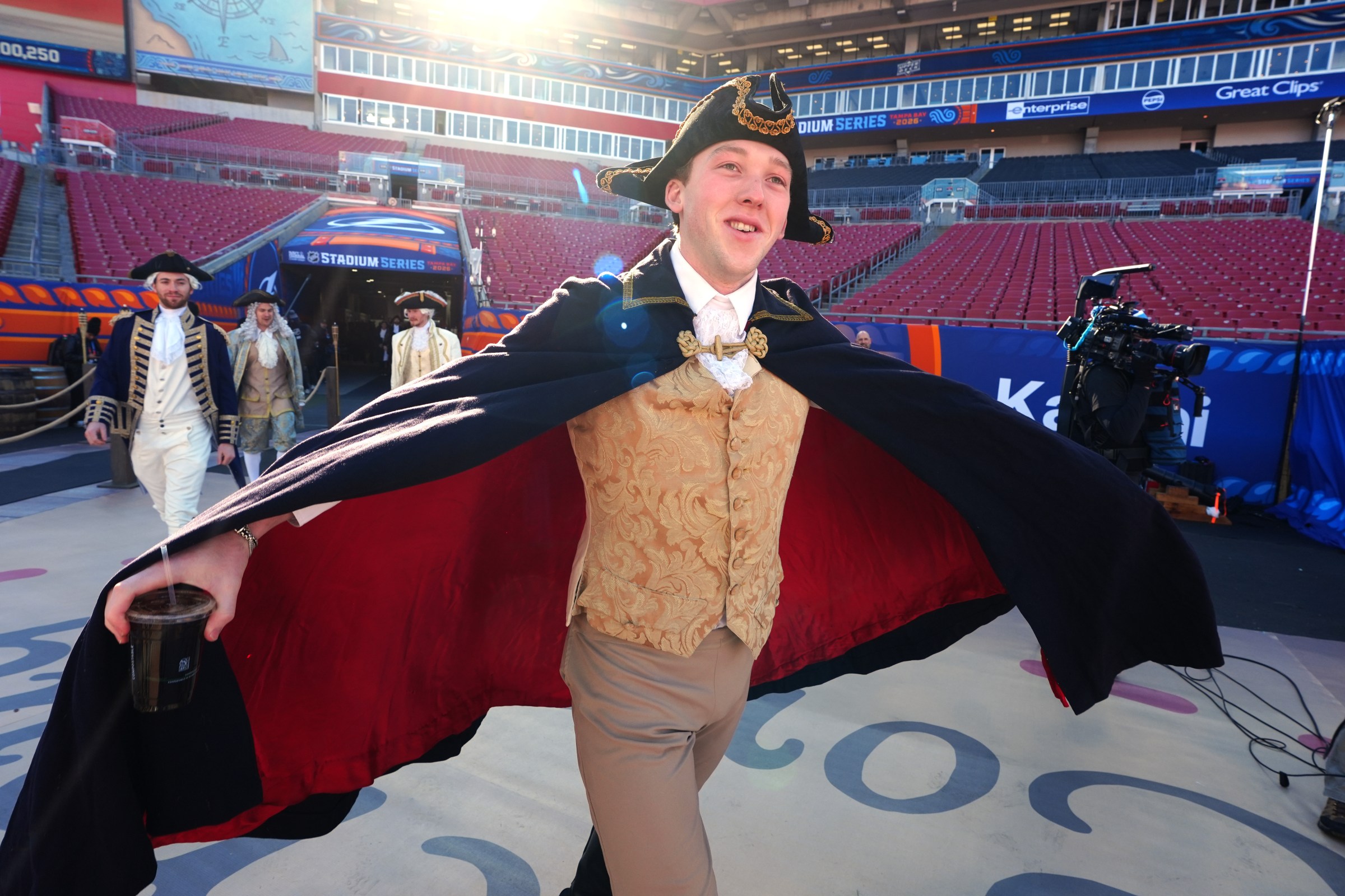 TAMPA, FLORIDA - FEBRUARY 01: Mason Lohrei #6 of the Boston Bruins arrives dressed as a Colonial Patriot before the 2026 NHL Stadium Series game between the Boston Bruins and the Tampa Bay Lightning at Raymond James Stadium on February 01, 2026 in Tampa, Florida. (Photo by Brian Babineau/NHLI via Getty Images)