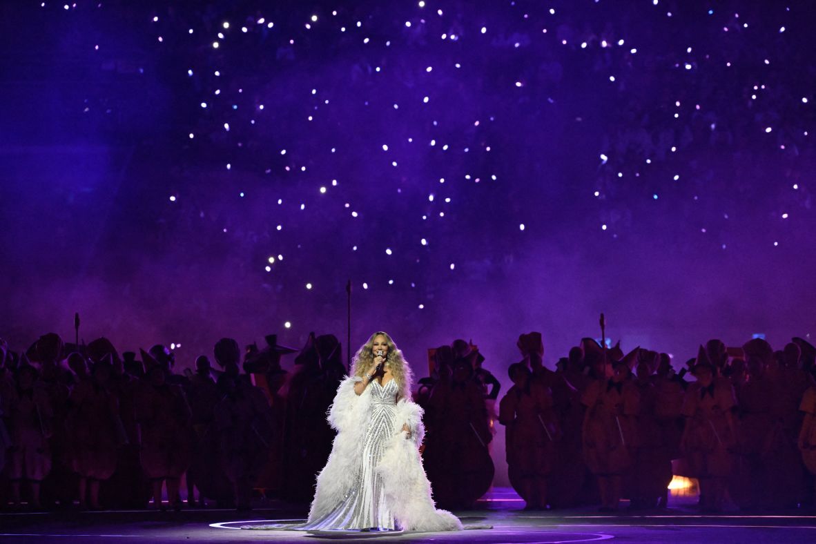 Legendary American songstress Mariah Carey sings during the opening ceremony. <a href=