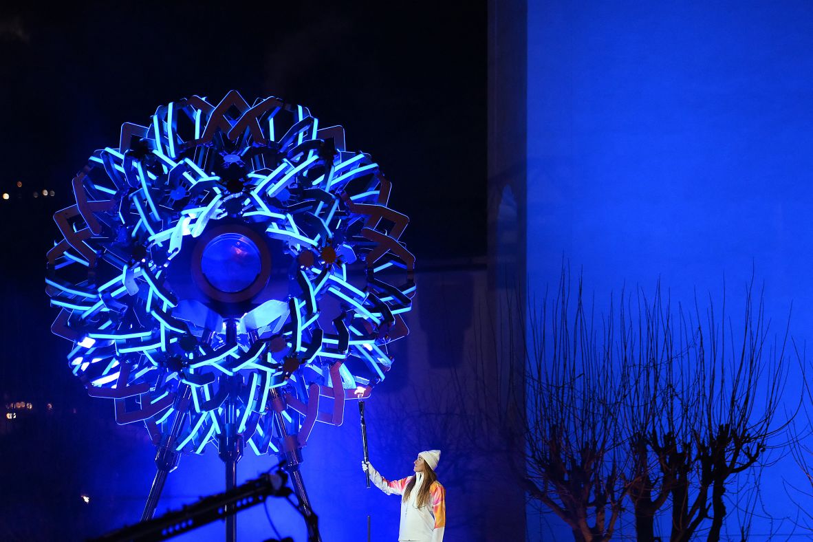 Italian skier Sofia Goggia lights the Olympic cauldron in Cortina d'Ampezzo, Italy. This is the first time in history where there are two Olympic cauldrons burning during the Games.