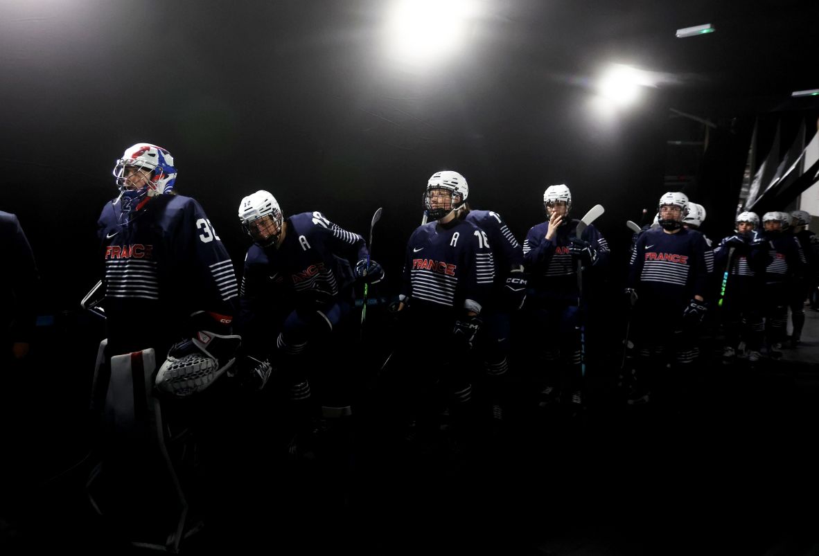 The French women's hockey team waits to take the ice before a game against Sweden.