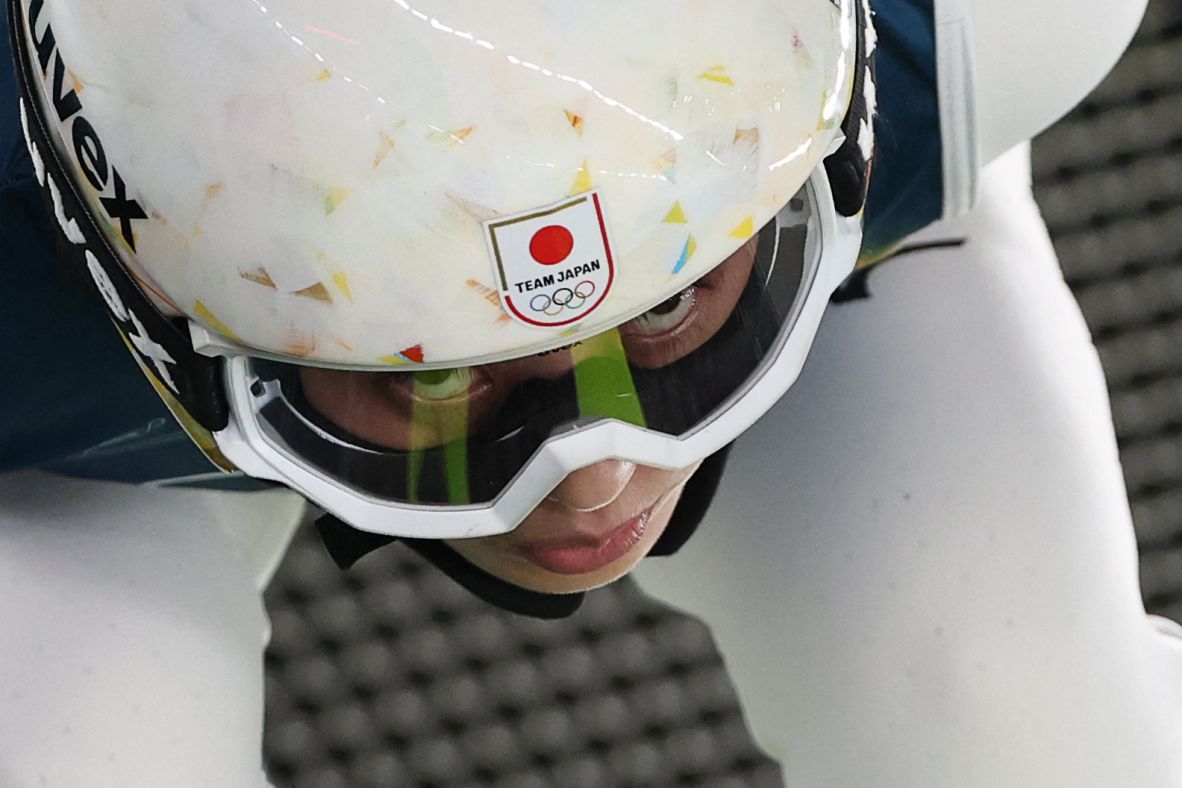 Japan's Nozomi Maruyama prepares to jump during a trial round in women's large hill ski jumping on February 15. Maruyama collected Japan's first medal of the 2026 Games in a ski jumping event a week prior.