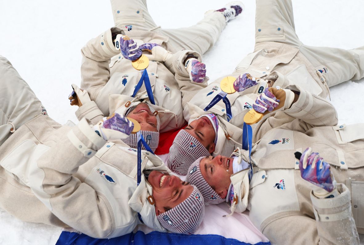 France's Quentin Fillon-Maillet, Emilien Jacquelin, Eric Perrot and Fabien Claude celebrate winning gold in the men's biathlon 4 x 7.5km relay on February 17.
