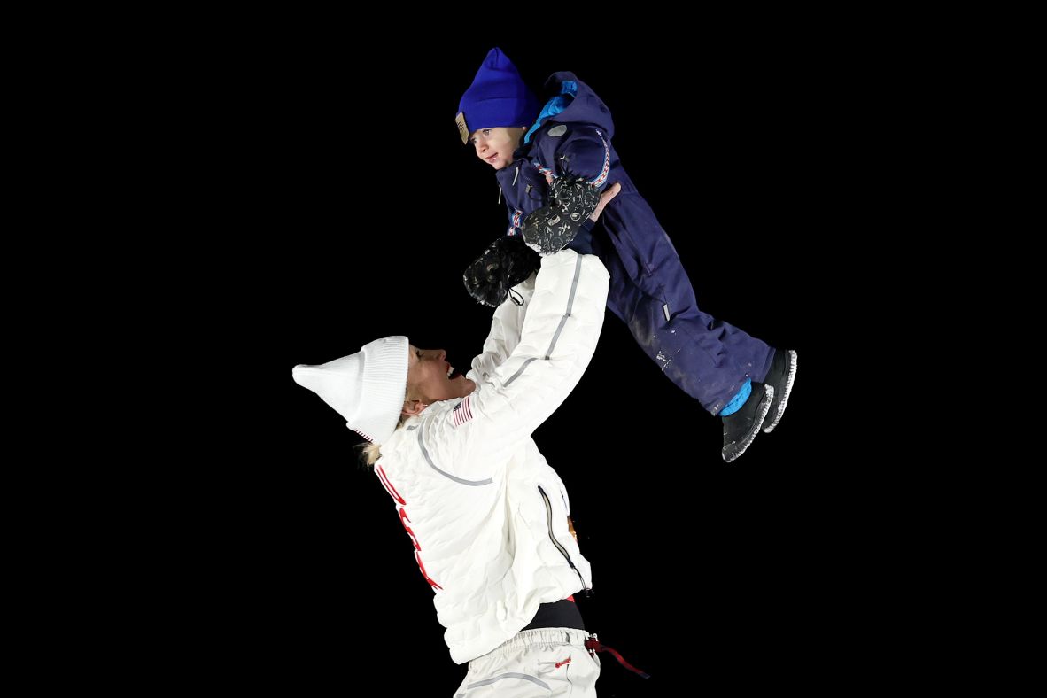 Bronze medalist Kaillie Humphries of Team USA celebrates with her son Aulden during the medal ceremony for the women's monobob on February 16.
