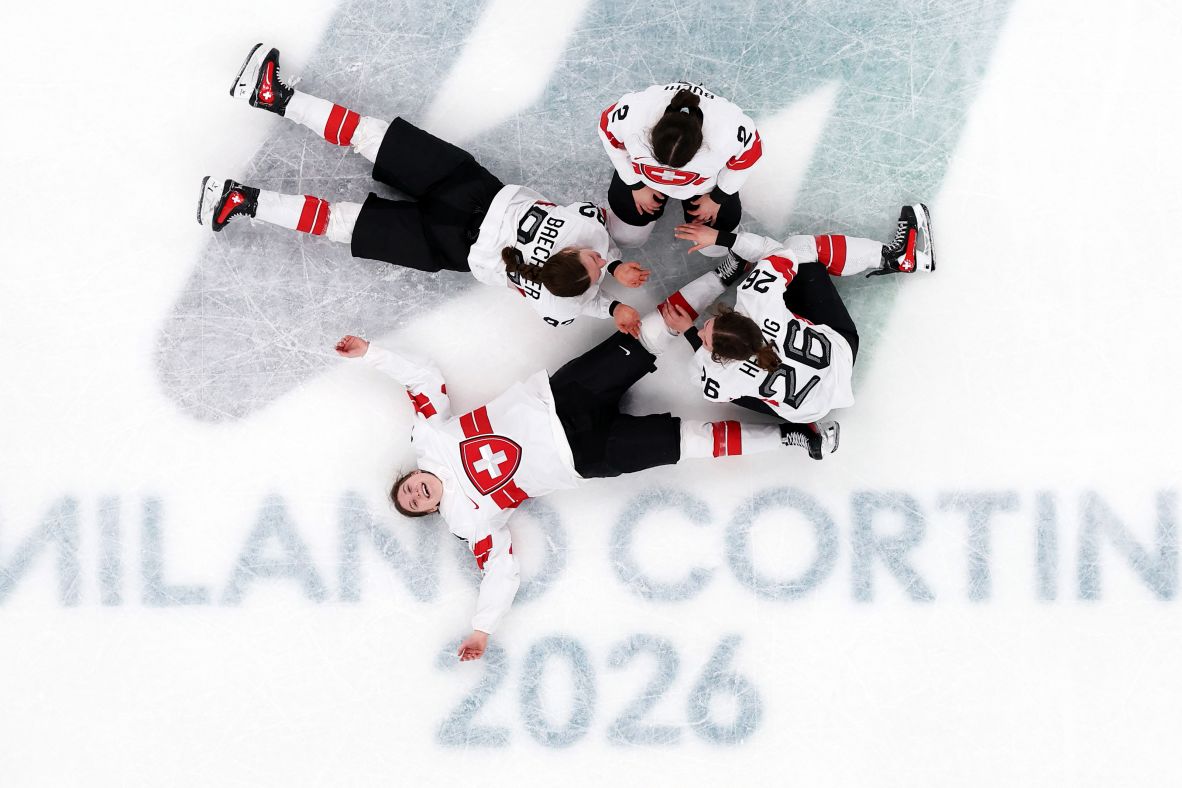 Team Switzerland celebrates winning bronze in women's hockey after the team's <a href=