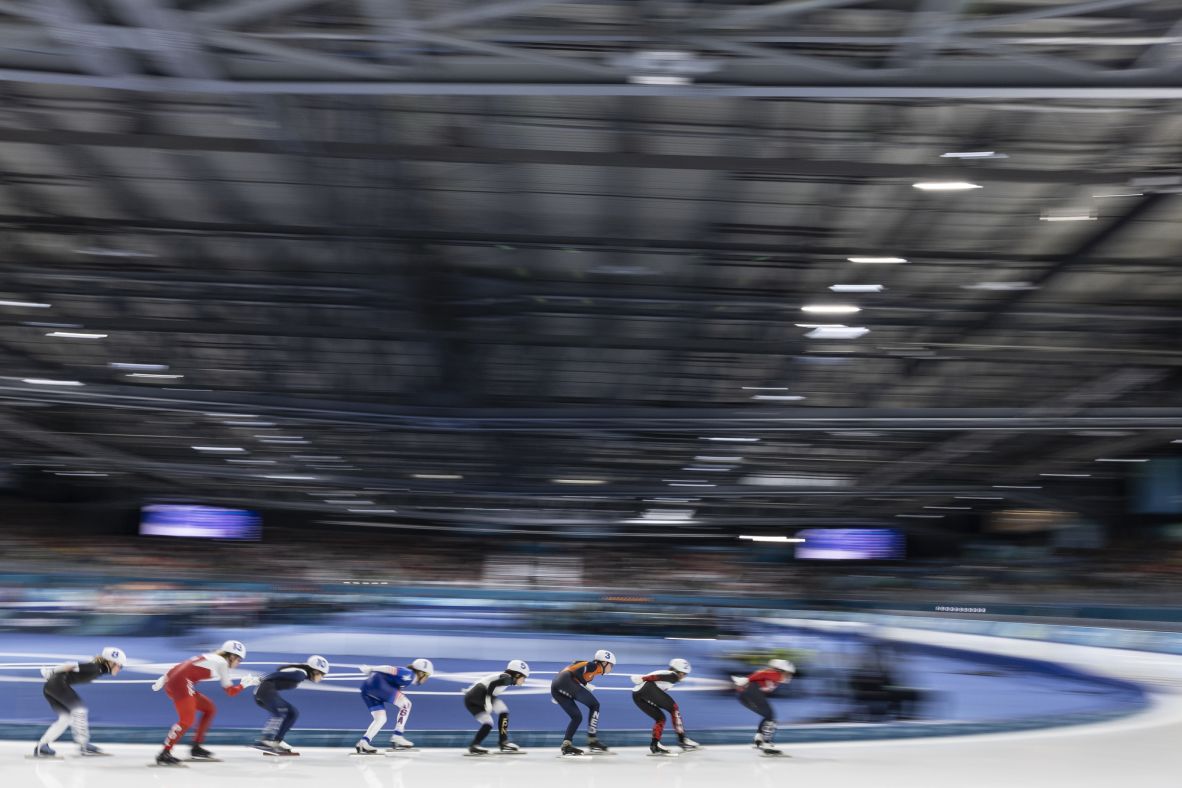 Athletes compete during the women's mass start speedskating semifinal in Milan on February 21.
