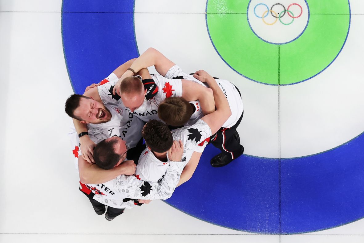 Gold medalists Brad Jacobs, Marc Kennedy, Brett Gallant and Ben Hebert of Team Canada celebrate victory with coach Paul Webster after winning the curling final against Great Britain, on February 21. Canada's Marc Kennedy came under fire earlier in the Games for allegedly cheating during a round robin game against Switzerland.