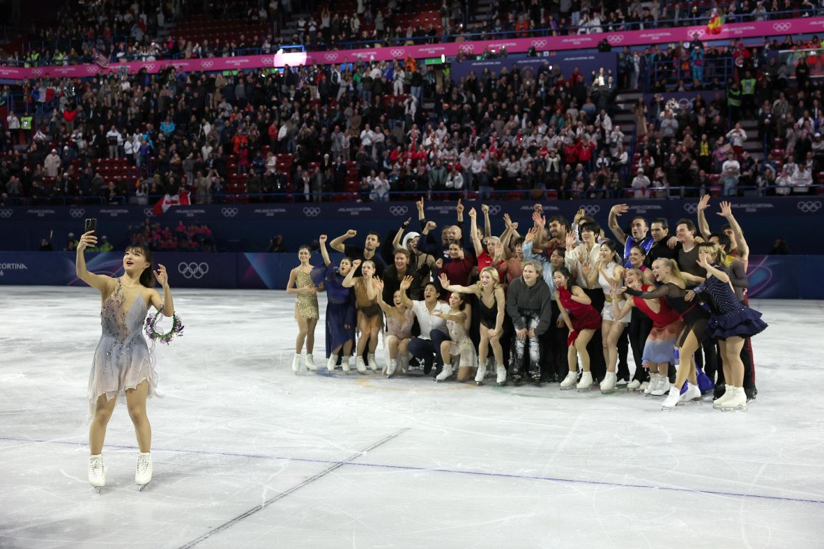 Japan's Kaori Sakamoto poses for a selfie with fellow athletes during the figure skating exhibition gala on February 21.