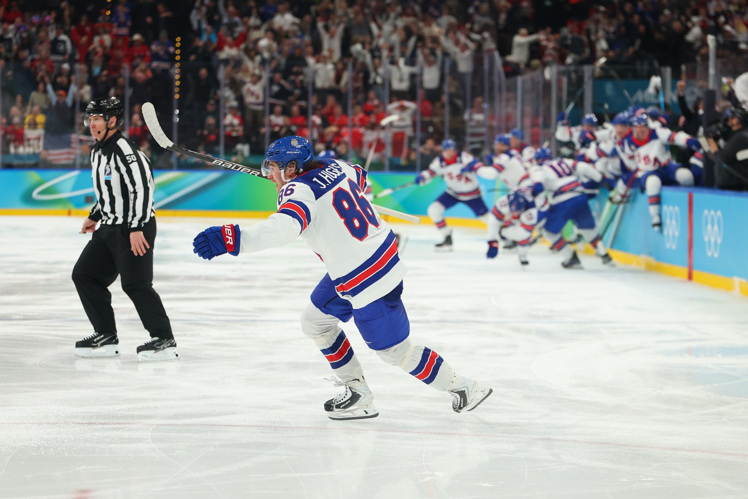 MILAN, ITALY - FEBRUARY 22: Jack Hughes #86 of Team United States celebrates scoring the game-winning goal to win the gold medals in overtime during the Men’s Gold Medal match between Canada and the United States on day 16 of the Milano Cortina 2026 Winter Olympic games at Milano Santagiulia Ice Hockey Arena on February 22, 2026 in Milan, Italy. (Photo by Gregory Shamus/Getty Images)