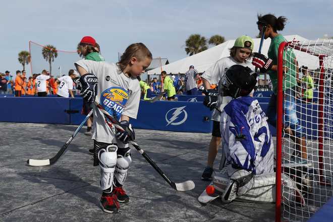 CLEARWATER, FL - JANUARY 27: Youth teams from the Tampa Bay Lightning's Build the Thunder program play ball hockey during the NHL All-Star Beach Bash as part of the 2018 Honda NHL All Star Weekend on January 27, 2018 at Pier 60 in Clearwater, Florida.  (Photo by Mark LoMoglio/NHLI via Getty Images)