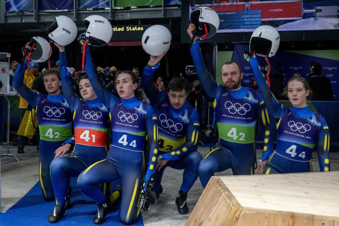 At the end of the luge relay, members of the Ukrainian team take a knee and raise their helmets in solidarity with their Ukrainian skeleton slider Vladyslav Heraskevych. <a href=