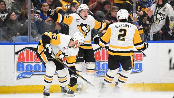 BUFFALO, NEW YORK - FEBRUARY 5: Avery Hayes #85 of the Pittsburgh Penguins celebrates with teammates after scoring his first career goal during the first period of an NHL against the Buffalo Sabres game at KeyBank Center on February 5, 2026 in Buffalo, New York. (Photo by Joe Hrycych/Getty Images)