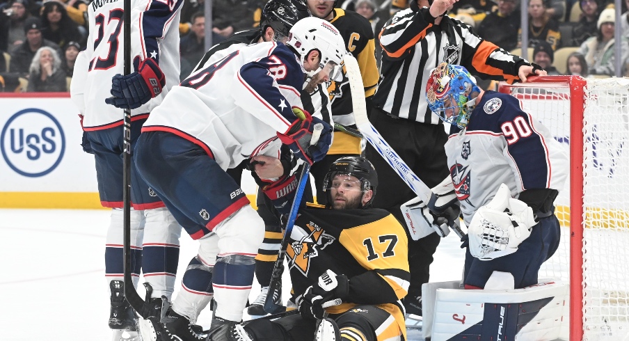 Jan 17, 2026; Pittsburgh, Pennsylvania, USA; Pittsburgh Penguins right wing Bryan Rust (17) gets tangled up with Columbus Blue Jackets center Boone Jenner (38) during the third period at PPG Paints Arena. Columbus won 4-3 in a shoot out.