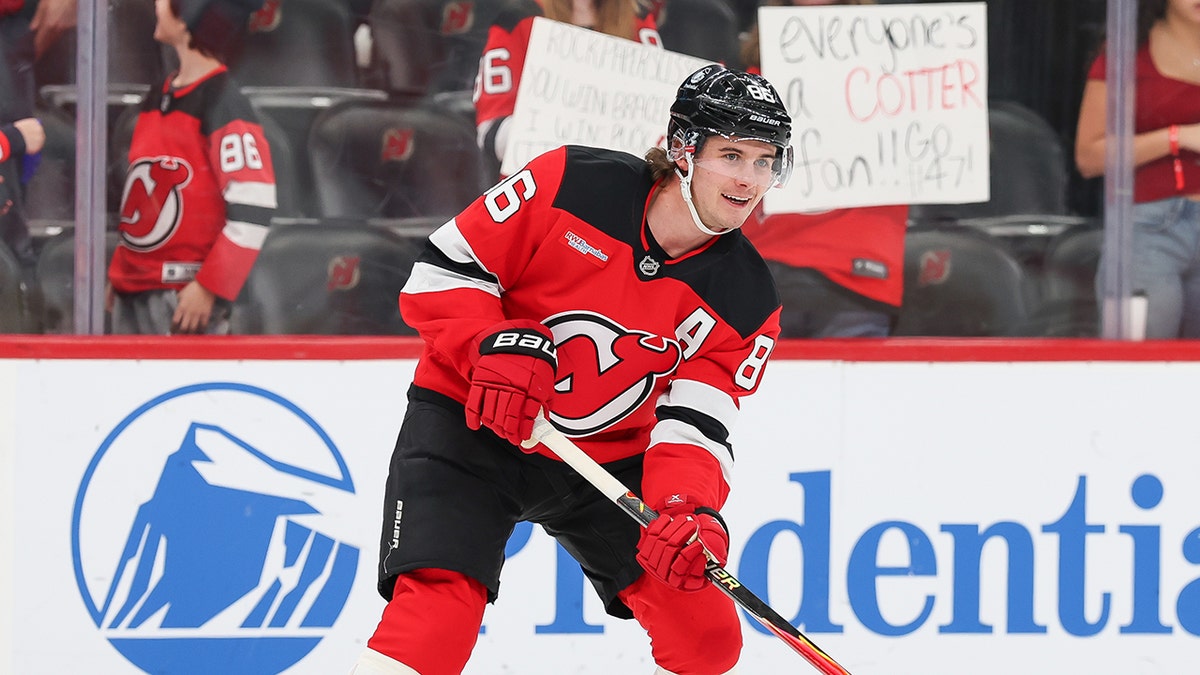 Jack Hughes with Devils