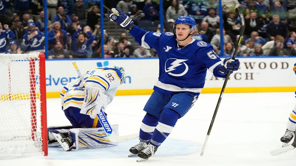 Tampa Bay Lightning center Jake Guentzel (59) celebrates after scoring the game-winning goal against Buffalo Sabres goaltender Colten Ellis (92) during and overtime period of an NHL hockey game Tuesday, Feb. 3, 2026, in Tampa, Fla. (AP Photo/Chris O'Meara)