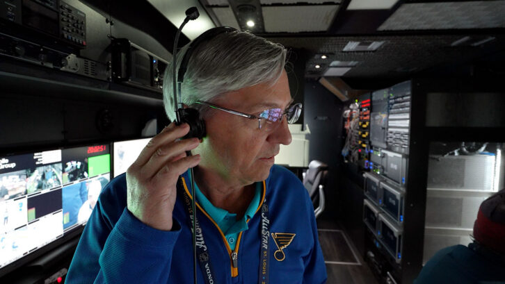 Joe Geerling wears a headset inside the production truck.