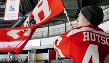 Lane Hutson returns to BU in brother Cole’s jersey, waves flag in Terriers’ overtime win