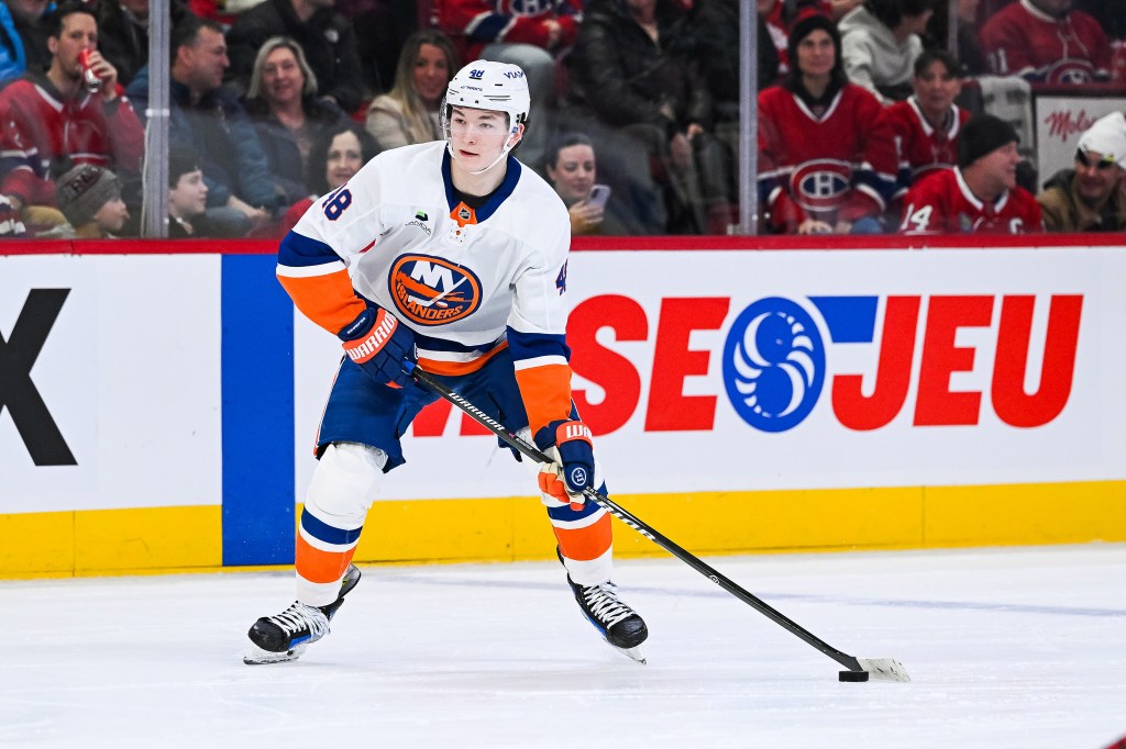 New York Islanders defenseman Matthew Schaefer (48) plays the puck against the Montreal Canadiens during the third period at Bell Centre.
