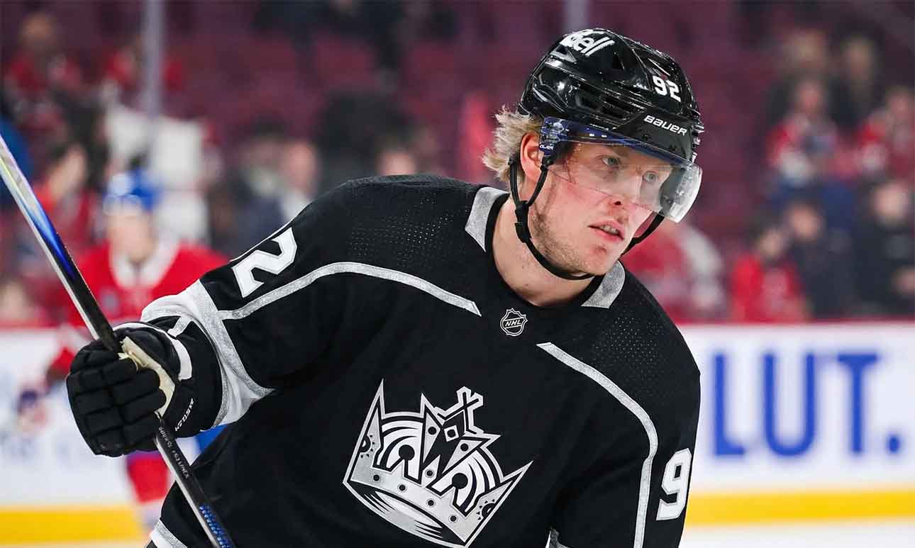 A mock-up illustration showing current Montreal Canadiens forward Patrik Laine wearing a black number 92 Los Angeles Kings jersey and helmet, holding his hockey stick on the ice.