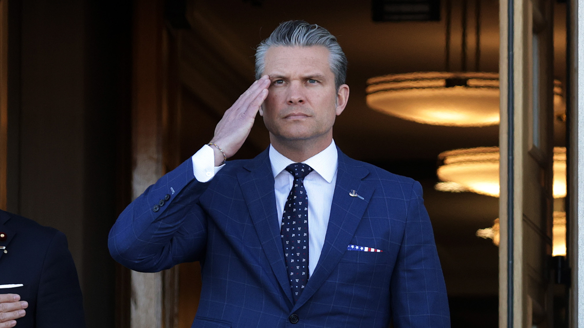 U.S. Secretary of War Pete Hegseth salutes