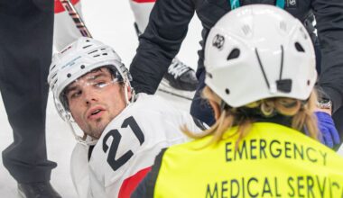 Switzerland's Fiala leaves ice on stretcher with leg injury