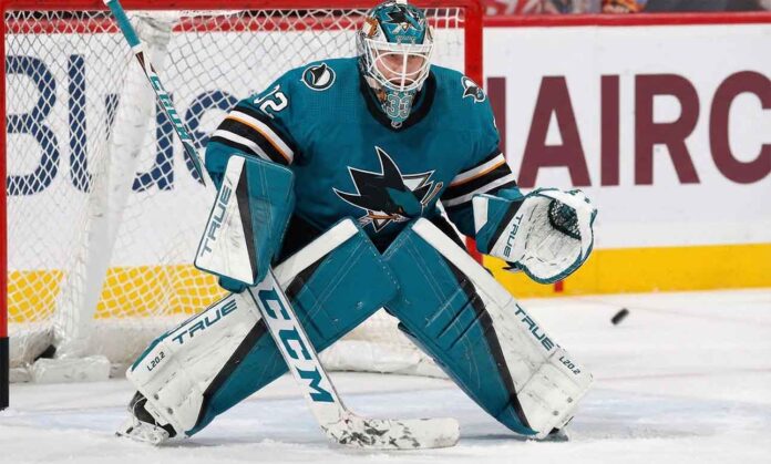 Sergei Bobrovsky pictured in a full teal and black San Jose Sharks goaltending uniform, positioned in a butterfly stance on the ice in front of the net.