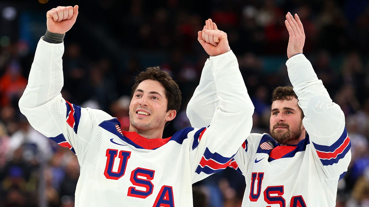 Zach Werenski and Dylan Larkin celebrate