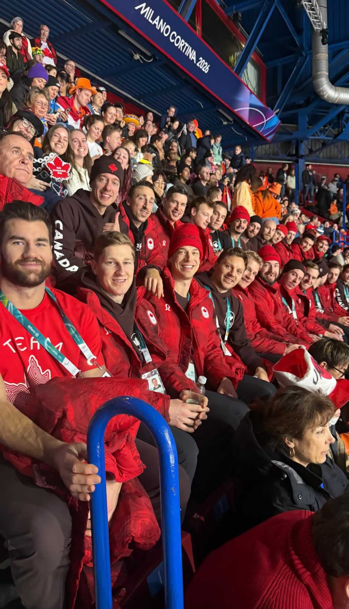 Tom Wilson poses with Nathan MacKinnon, Darcy Kuemper, Sidney Crosby, Drew Doughty, Cale Makar and other Canadian hockey players at the Olympics