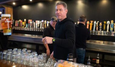 Troy Aikman tending bar at The Katy Trail Ice House