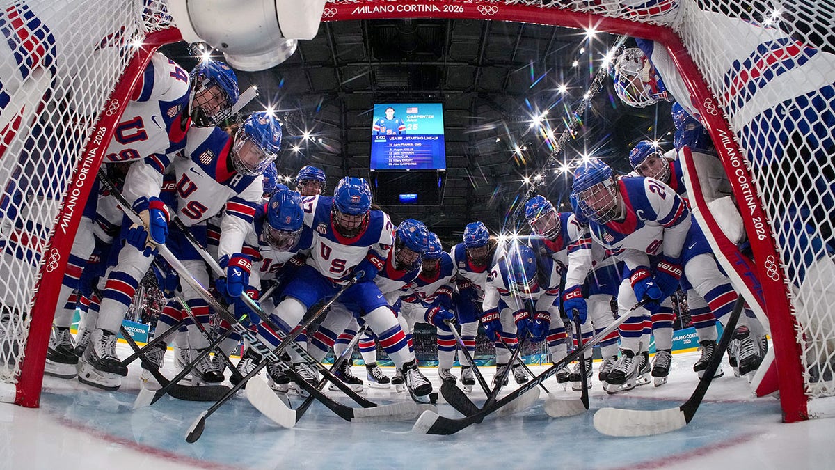 Team USA huddles by net