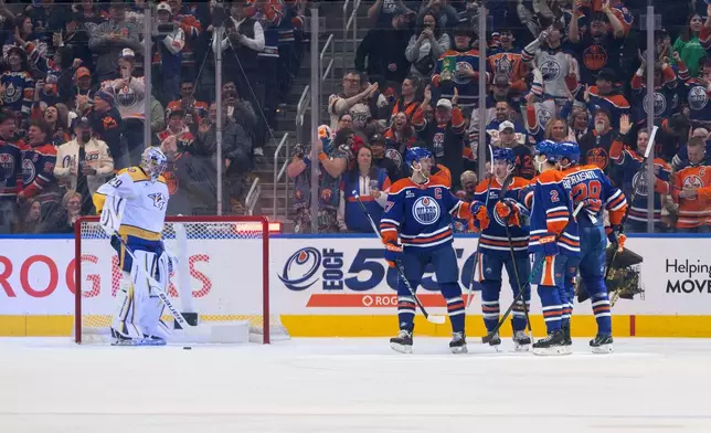 CORRECTS PERIOD TO FIRST NOT SECOND - Nashville Predators goalie Justus Annunen (29) looks on as the Edmonton Oilers celebrate a goal during the first period of an NHL hockey game in Edmonton, Alberta, Sunday, March 15, 2026. (Jason Franson/The Canadian Press via AP)