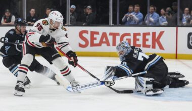 Feb 25, 2025; Salt Lake City, Utah, USA; Utah Hockey Club goaltender Karel Vejmelka (70) blocks the shot of Chicago Blackhawks right wing Ilya Mikheyev (95) during the second period at Delta Center. Mandatory Credit: Rob Gray-Imagn Images