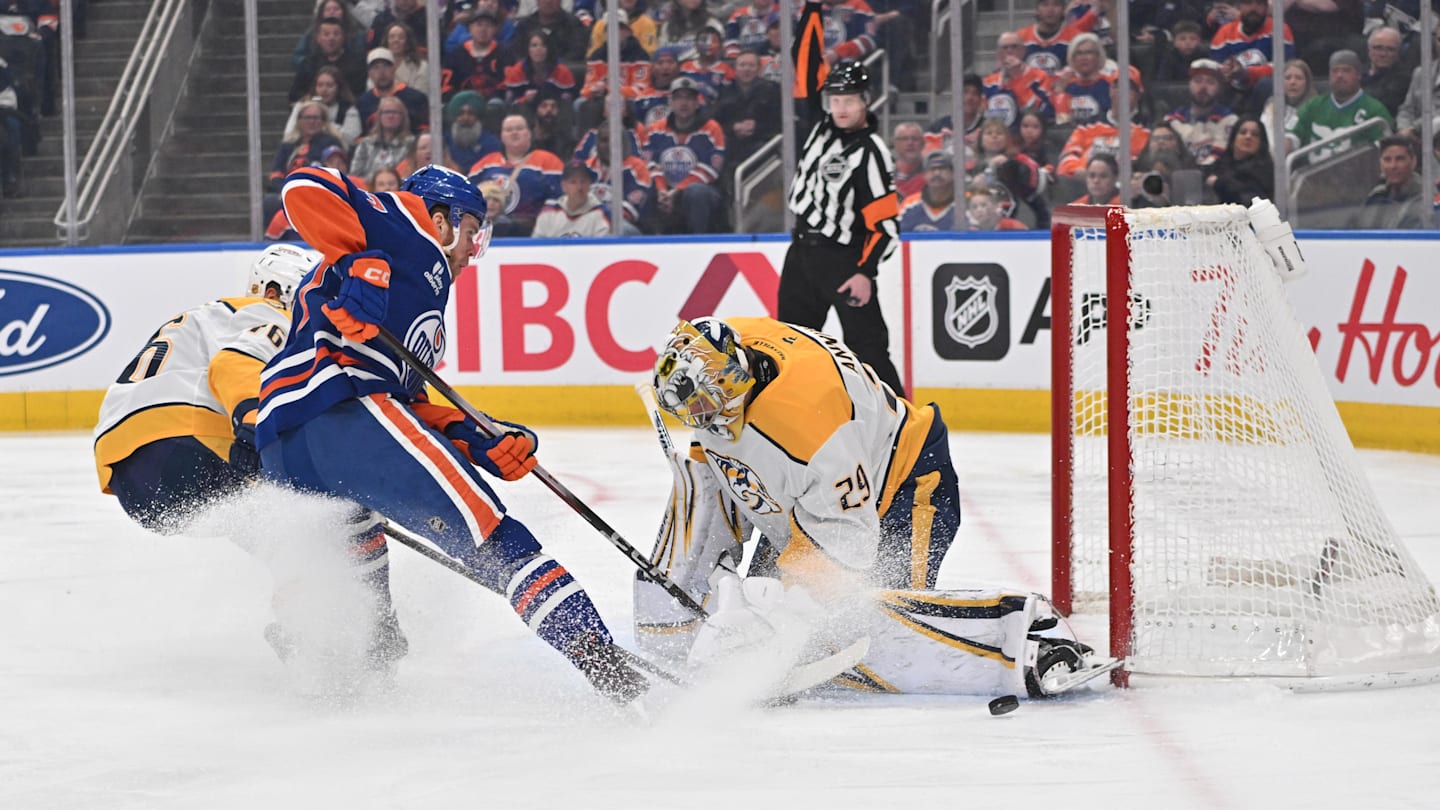 Mar 15, 2026; Edmonton, Alberta, CAN; Nashville Predators  defenseman Brady Skjei (76) with Edmonton Oilers center Connor McDavid (97) goes for a shot on Nashville Predators goalie Justus Annunen (29) during the first period at Rogers Place. Mandatory Credit: Walter Tychnowicz-Imagn Images