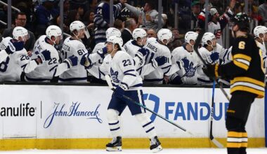 Mar 24, 2026; Boston, Massachusetts, USA; As Boston Bruins defenseman Mason Lohrei (6) heads for his bench, Toronto Maple Leafs left wing Matthew Knies (23) is congratulated at the bench after scoring a shorthanded goal during the second period at TD Garden. Mandatory Credit: Winslow Townson-Imagn Images