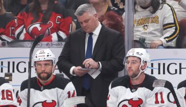 Jan 8, 2026; Pittsburgh, Pennsylvania, USA;  New Jersey Devils head coach Sheldon Keefe makes a note on the bench against the Pittsburgh Penguins during the first period at PPG Paints Arena. Mandatory Credit: Charles LeClaire-Imagn Images