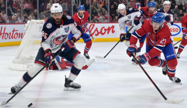 Mar 26, 2026; Montreal, Quebec, CAN; Columbus Blue Jackets forward Kirill Marchenko (86) plays the puck and Montreal Canadiens defenseman Kaiden Guhle (21) defends during the third period at the Bell Centre. Mandatory Credit: Eric Bolte-Imagn Images