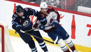 Mar 26, 2026; Winnipeg, Manitoba, CAN; Winnipeg Jets center Adam Lowry (17) and Colorado Avalanche center Martin Necas (88) tangle up during the first period at Canada Life Centre. Mandatory Credit: James Carey Lauder-Imagn Images