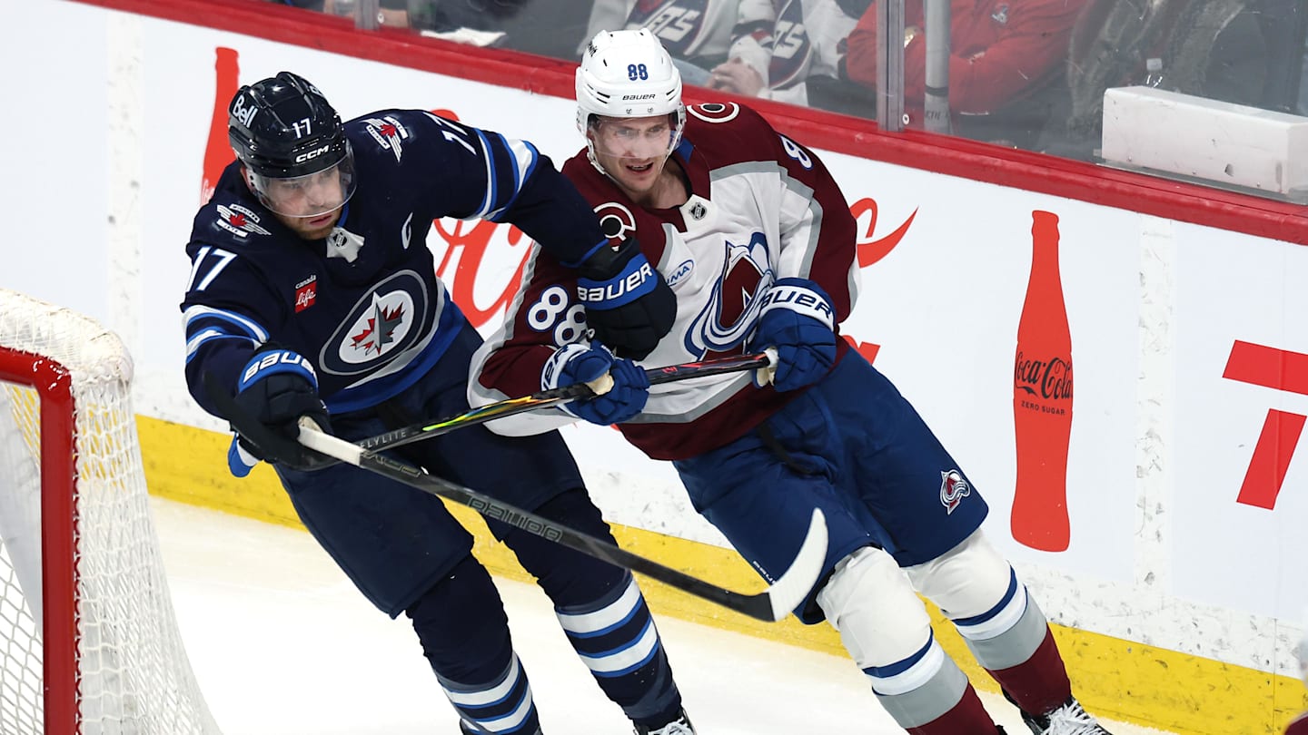 Mar 26, 2026; Winnipeg, Manitoba, CAN; Winnipeg Jets center Adam Lowry (17) and Colorado Avalanche center Martin Necas (88) tangle up during the first period at Canada Life Centre. Mandatory Credit: James Carey Lauder-Imagn Images