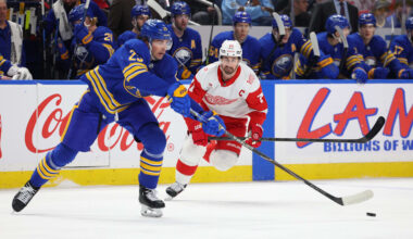 Mar 27, 2026; Buffalo, New York, USA;  Detroit Red Wings center Dylan Larkin (71) looks to defend as Buffalo Sabres defenseman Owen Power (25) makes a pass during the first period at KeyBank Center. Mandatory Credit: Timothy T. Ludwig-Imagn Images