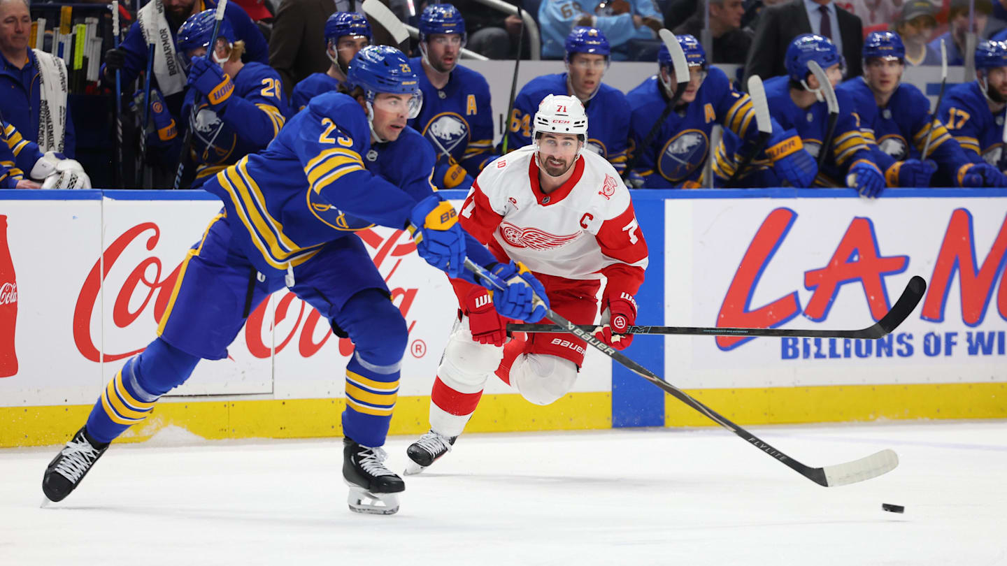 Mar 27, 2026; Buffalo, New York, USA;  Detroit Red Wings center Dylan Larkin (71) looks to defend as Buffalo Sabres defenseman Owen Power (25) makes a pass during the first period at KeyBank Center. Mandatory Credit: Timothy T. Ludwig-Imagn Images