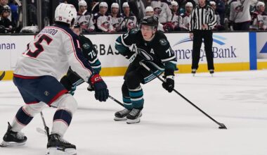 Jan 6, 2026; San Jose, California, USA; San Jose Sharks center Macklin Celebrini (71) looks to get a shot off in front of Columbus Blue Jackets defenseman Dante Fabbro (15) as San Jose Sharks left wing William Eklund (72) trails the play in the second period at SAP Center at San Jose. Mandatory Credit: David Gonzales-Imagn Images