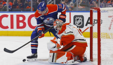 Mar 28, 2026; Edmonton, Alberta, CAN; Edmonton Oilers forward Zach Hyman (18) tries to get to a loose puck in front of Anaheim Ducks goaltender Lucas Dostal (1) during the first period at Rogers Place. Mandatory Credit: Perry Nelson-Imagn Images