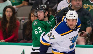 Sep 22, 2014; Dallas, TX, USA; Dallas Stars left wing Remi Elie (63) and St. Louis Blues left wing Paul Bissonnette (37) chase the puck during the game at the American Airlines Center. The Stars defeated the Blues 4-3. Mandatory Credit: Jerome Miron-Imagn Images