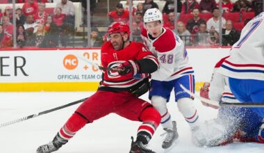 Mar 29, 2026; Raleigh, North Carolina, USA;  Montreal Canadiens defenseman Lane Hutson (48) and Carolina Hurricanes left wing Jordan Martinook (48) battle in front of the net ]during the first period at Lenovo Center. Mandatory Credit: James Guillory-Imagn Images