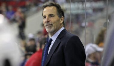 March 1, 2012; Raleigh, NC, USA; New York Rangers coach John Tortorella smiles during the game against the Carolina Hurricanes at the RBC center. The Rangers defeated the Hurricanes, 3-2. Mandatory Credit: James Guillory-Imagn Images