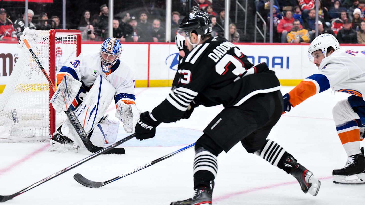 Feb 5, 2026; Newark, New Jersey, USA; New York Islanders goaltender Ilya Sorokin (30) defends against New Jersey Devils left wing Evgenii Dadonov (33) during the second period at Prudential Center. Mandatory Credit: John Jones-Imagn Images