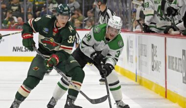 Sep 29, 2024; Saint Paul, Minnesota, USA;  Minnesota Wild forward Ben Jones (39) and Dallas Stars forward Cameron Hughes (34) battle for the puck during the second period at Xcel Energy Center. Mandatory Credit: Nick Wosika-Imagn Images