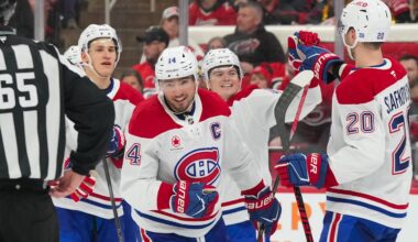 Mar 29, 2026; Raleigh, North Carolina, USA;  Montreal Canadiens center Nick Suzuki (14) celebrates his goal with left wing Juraj Slafkovsky (20), right wing Cole Caufield (13) and right wing Ivan Demidov (93) against the Carolina Hurricanes during the third period at Lenovo Center. Mandatory Credit: James Guillory-Imagn Images