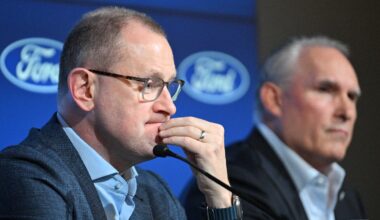 Toronto Maple Leafs general manager Brad Treliving listens to a question during a media conference to introduce new head coach Craig Berube (right) at Ford Performance Centre. Mandatory Credit: Dan Hamilton-Imagn Images