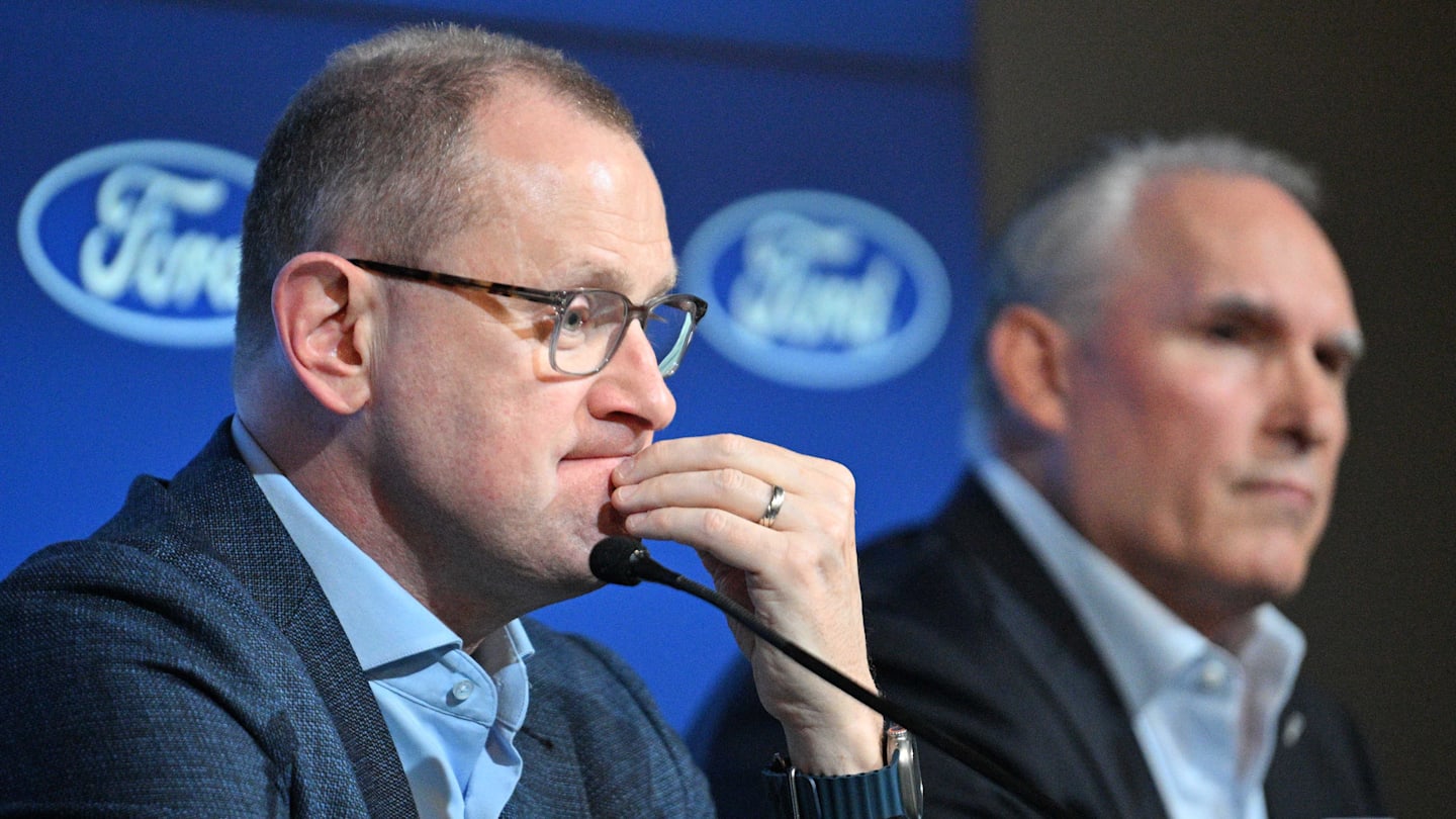 Toronto Maple Leafs general manager Brad Treliving listens to a question during a media conference to introduce new head coach Craig Berube (right) at Ford Performance Centre. Mandatory Credit: Dan Hamilton-Imagn Images